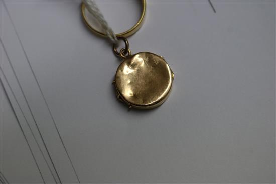 An 18ct gold seed pearl ring and a yellow metal and seed pearl locket.